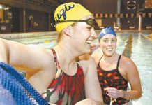 Augie swimmer survives broken neck